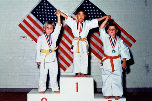 photo of young boys on medal stand