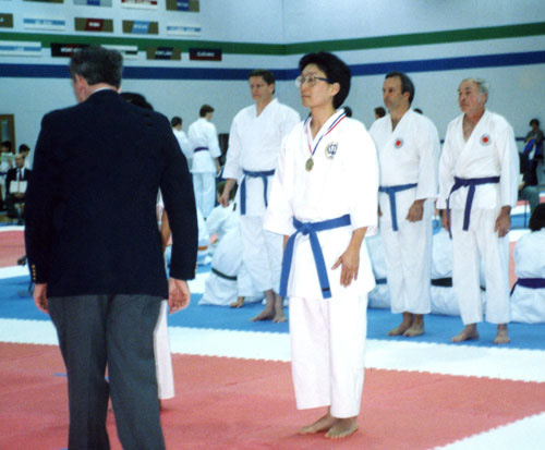 photo of men receiving karate medals