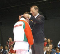 Hanshi Thiry awards a medal at international competition